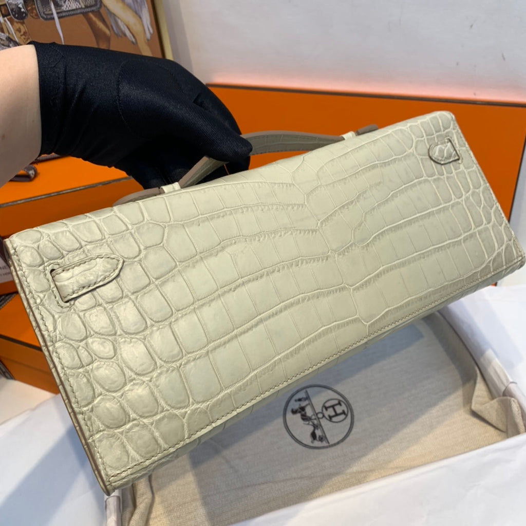 HERMES KELLY CUT 31 IN PEARL GRAY ALLIGATOR LEATHER WITH SILVER HARDWARE