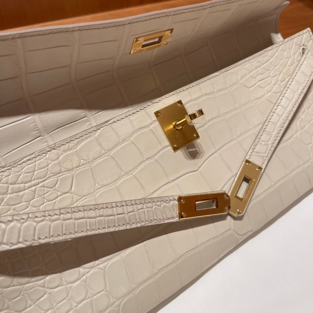 HERMES KELLY CUT 31 IN WHITE CREAM ALLIGATOR LEATHER WITH GOLD HARDWARE