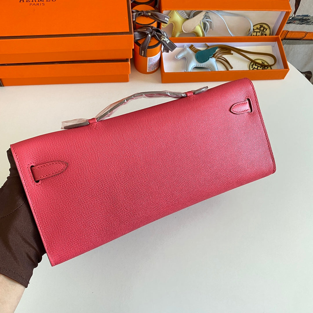 HERMES KELLY CUT 31 IN WATERMELON PINK CALFSKIN WITH GOLD HARDWARE
