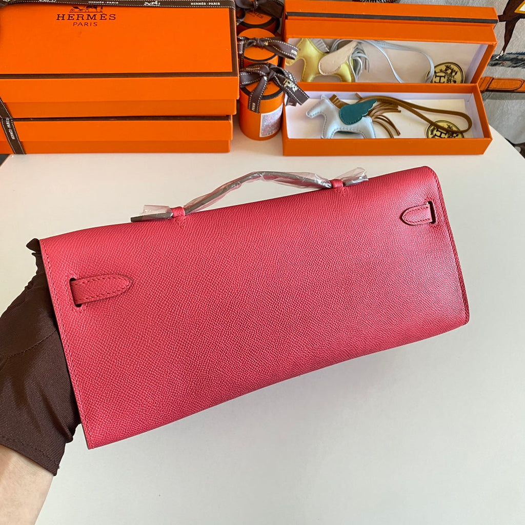 HERMES KELLY CUT 31 IN WATERMELON PINK CALFSKIN WITH SILVER HARDWARE