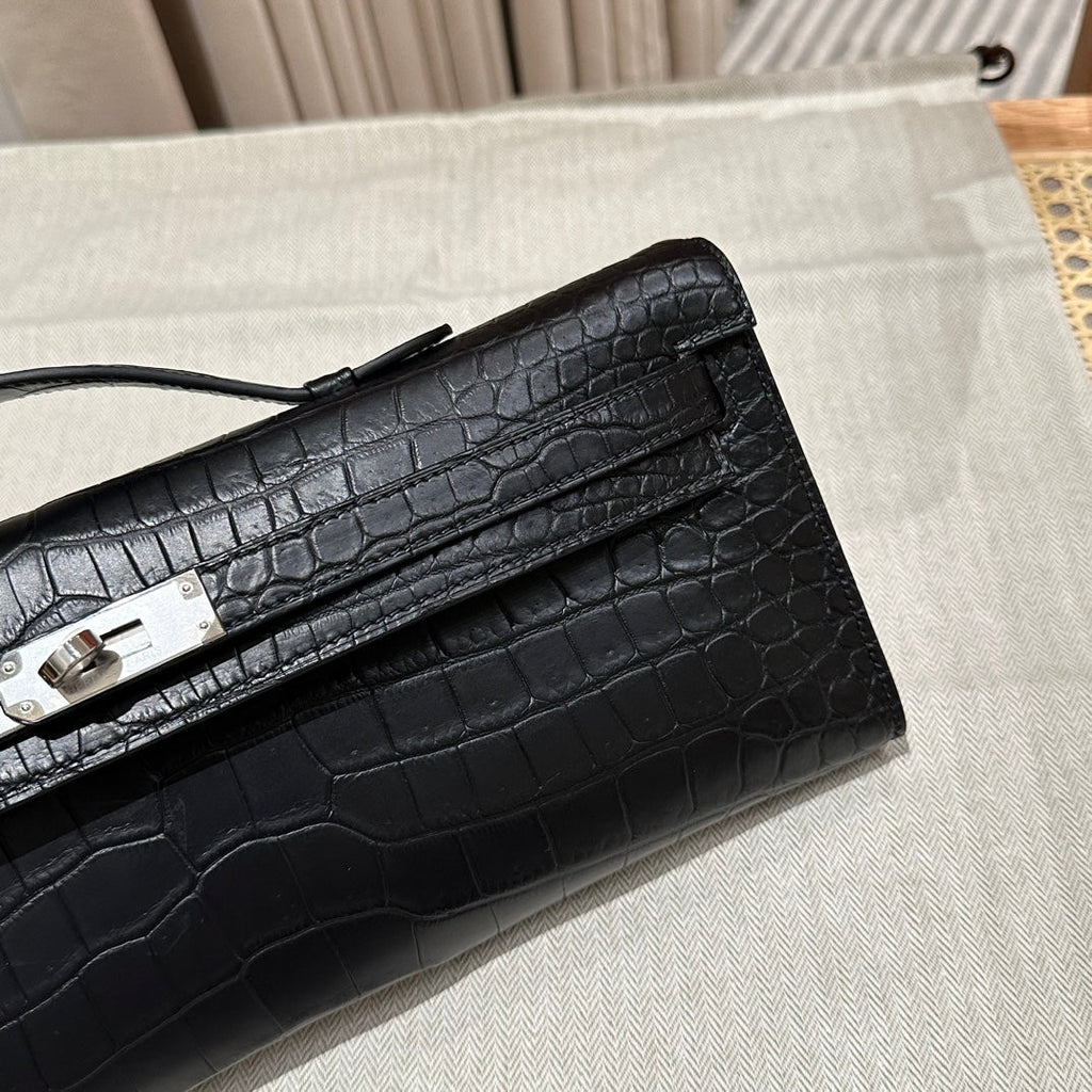 HERMES KELLY CUT 31 IN BLACK SHINY ALLIGATOR LEATHER WITH SILVER HARDWARE