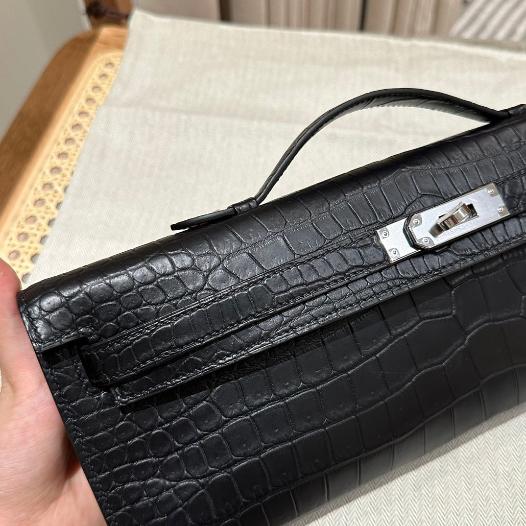 HERMES KELLY CUT 31 IN BLACK SHINY ALLIGATOR LEATHER WITH SILVER HARDWARE