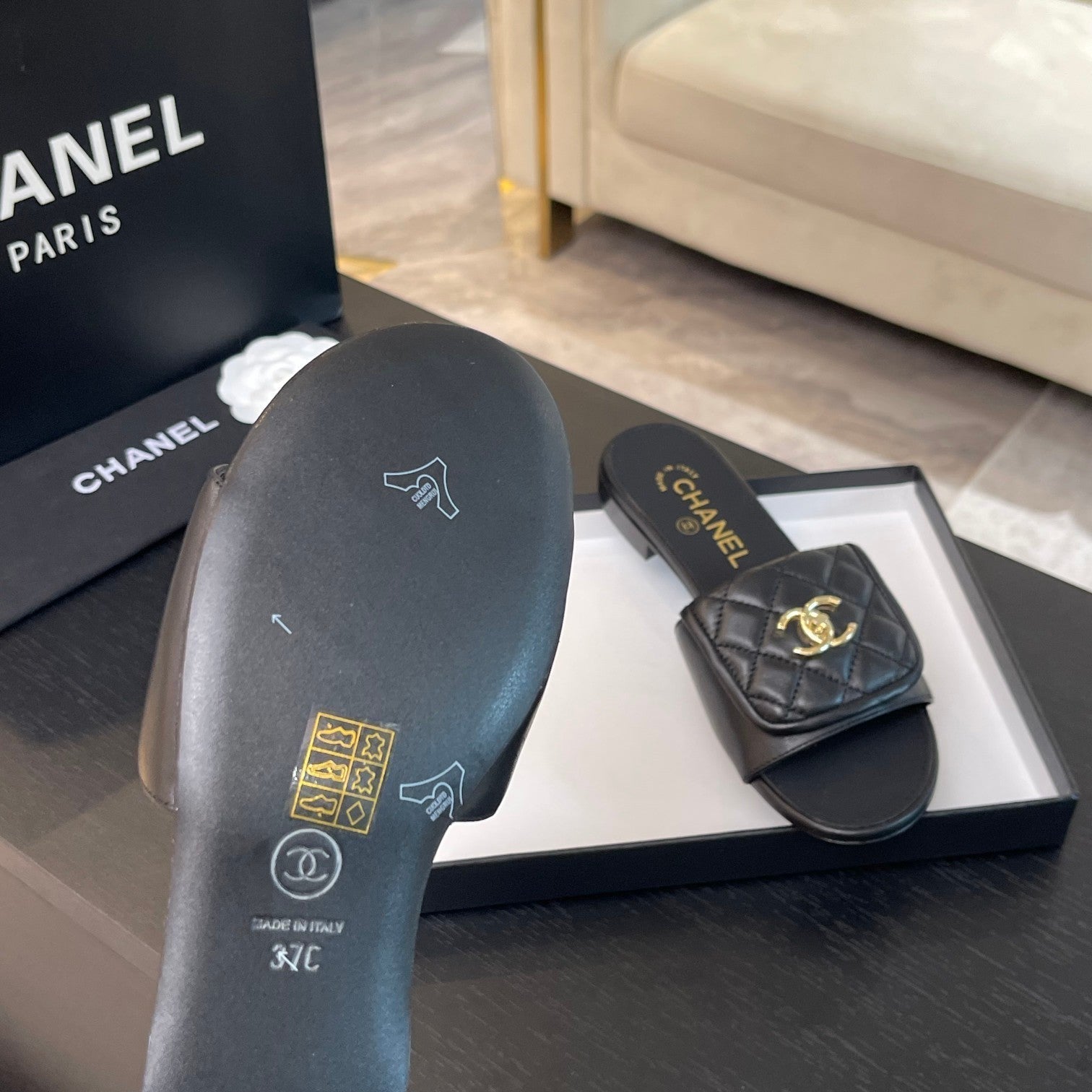 CHANEL FLAT MULE IN BLACK LAMBSKIN