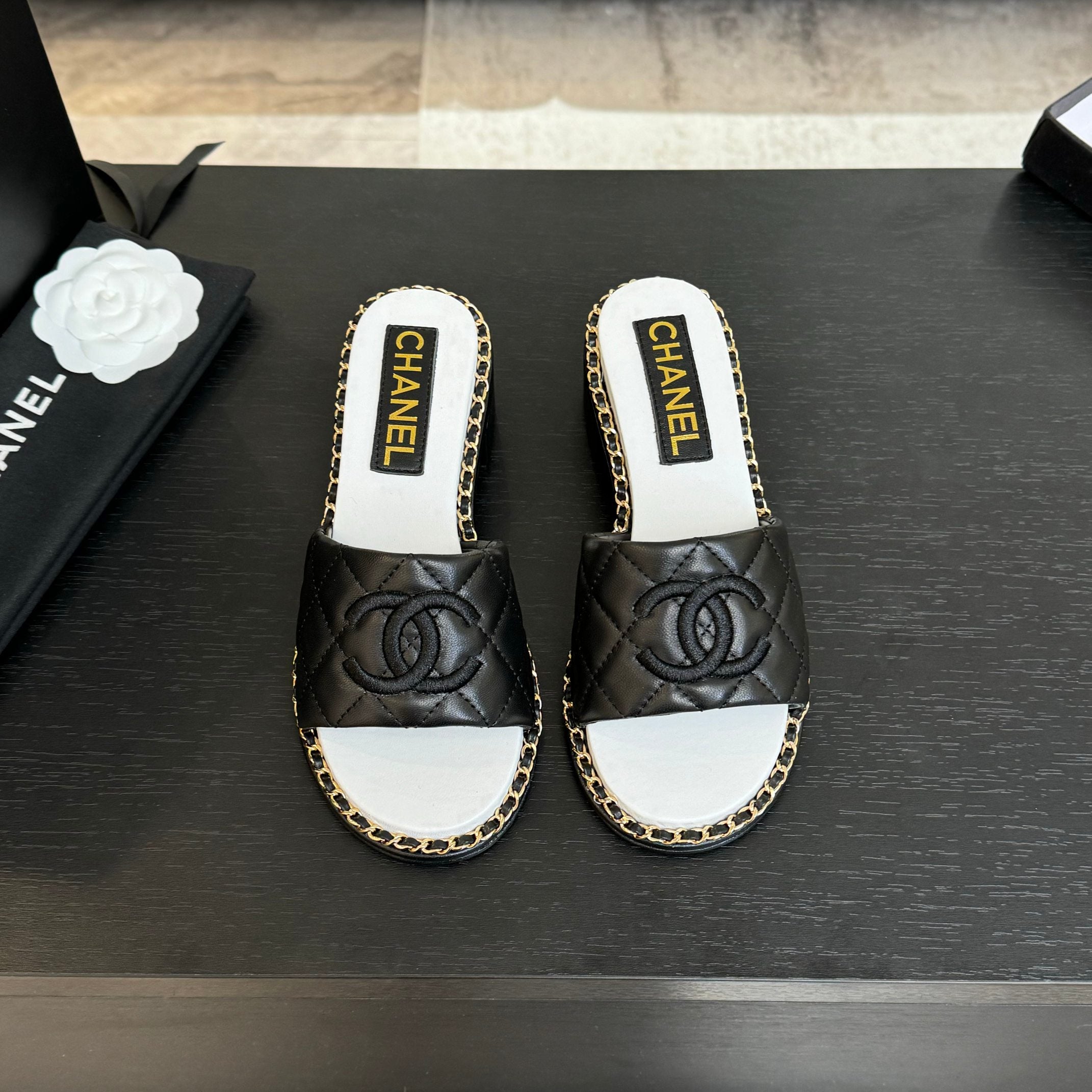 CHANEL HIGH FLATFORM SLIPPER IN BLACK EMBOSSED SHEEPSKIN