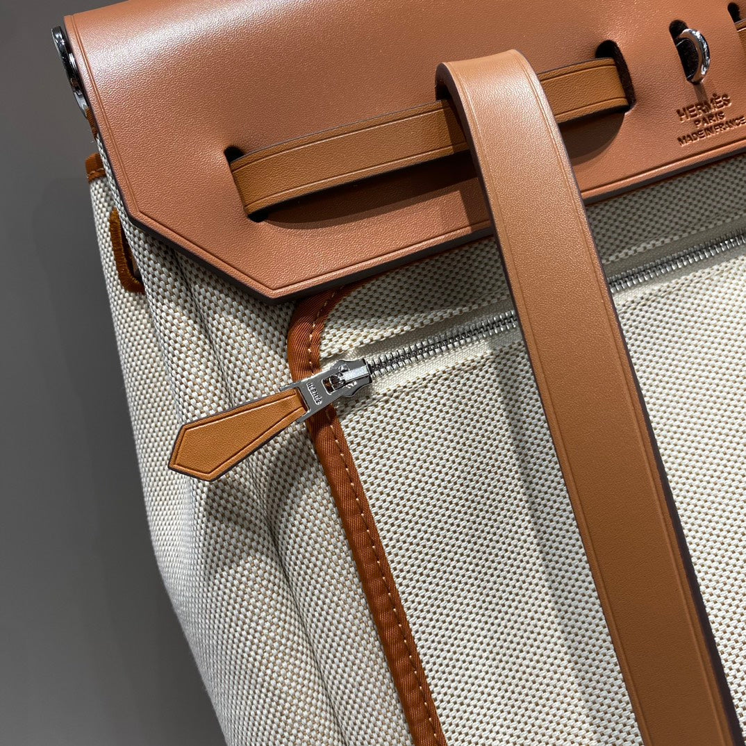HERMES HERBAG A DOS ZIP RETOURNE BACKPACK 29 IN OFF-WHITE CANVAS AND BROWN CALFSKIN