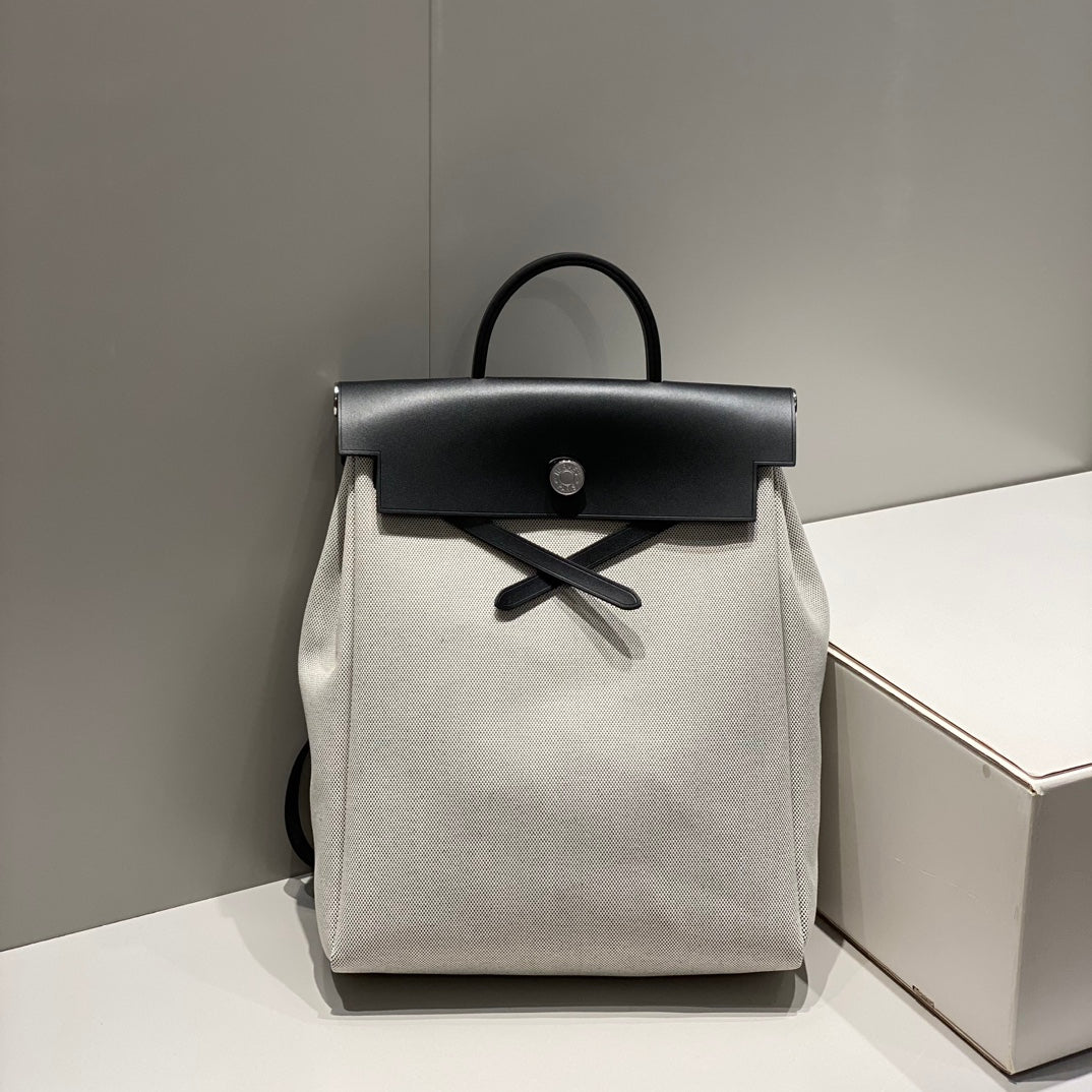 HERMES HERBAG A DOS ZIP RETOURNE BACKPACK 29 IN OFF-WHITE CANVAS AND BLACK CALFSKIN