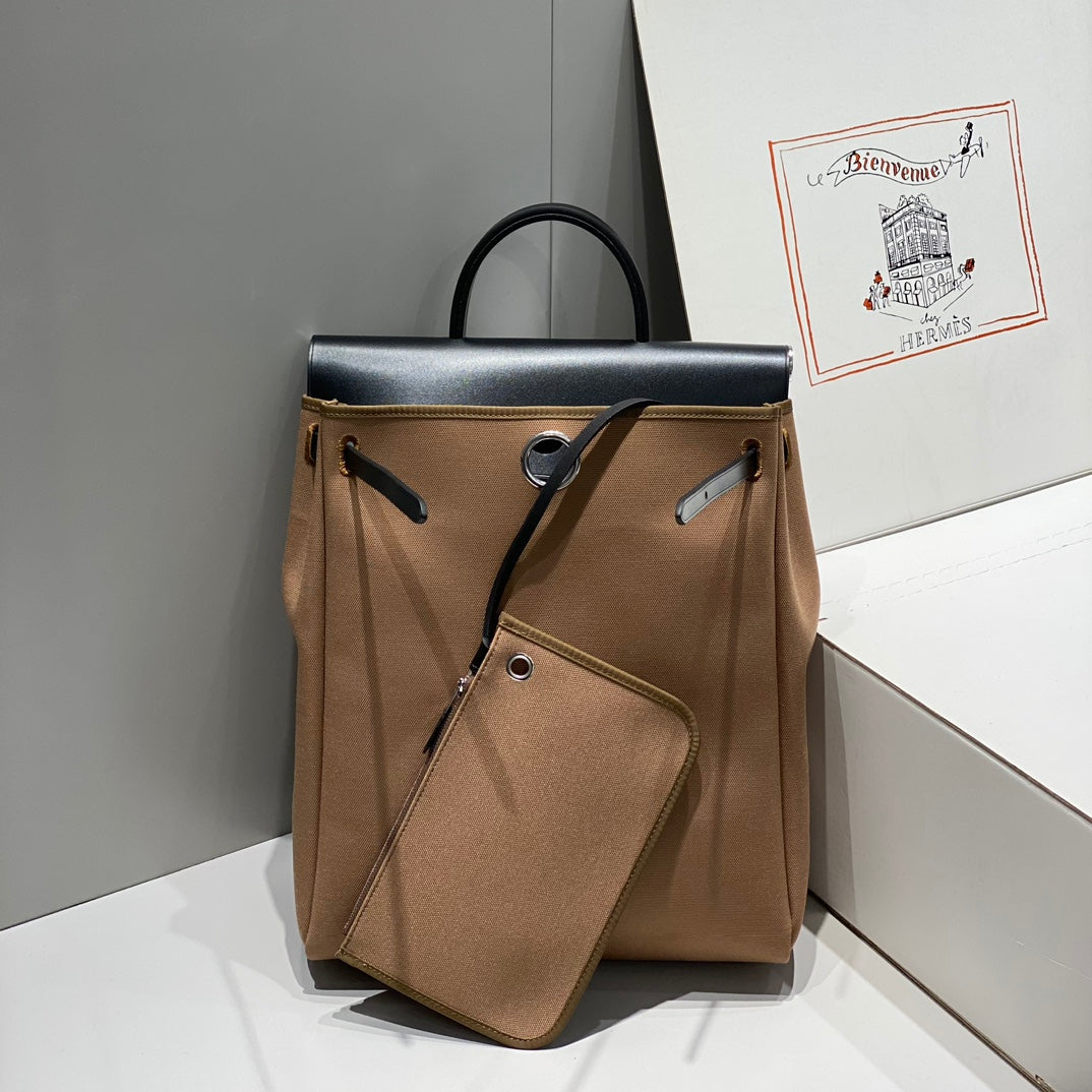 HERMES HERBAG A DOS ZIP RETOURNE BACKPACK 29 IN BROWN CANVAS AND BLACK CALFSKIN