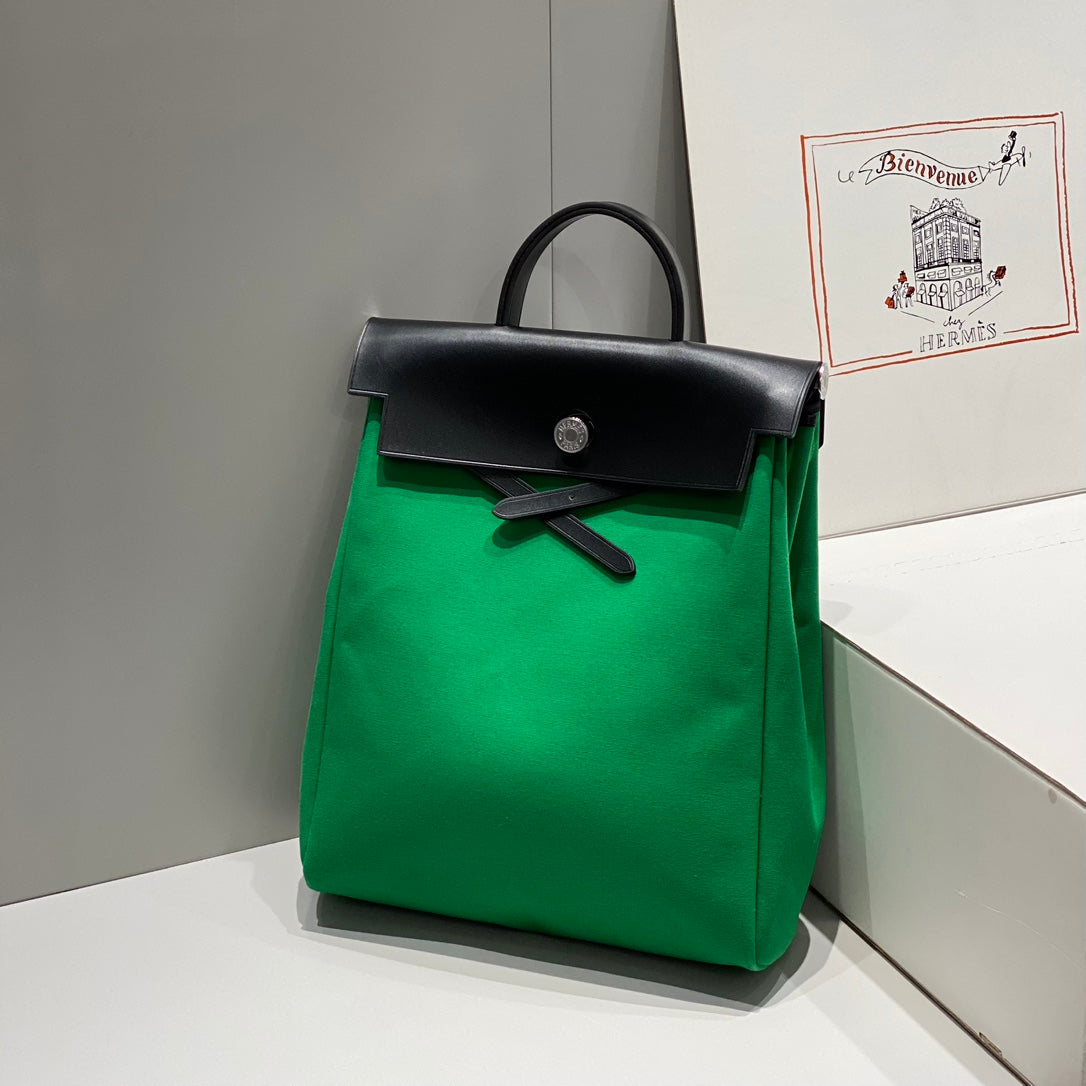 HERMES HERBAG A DOS ZIP RETOURNE BACKPACK 29 IN GREEN CANVAS AND BLACK CALFSKIN