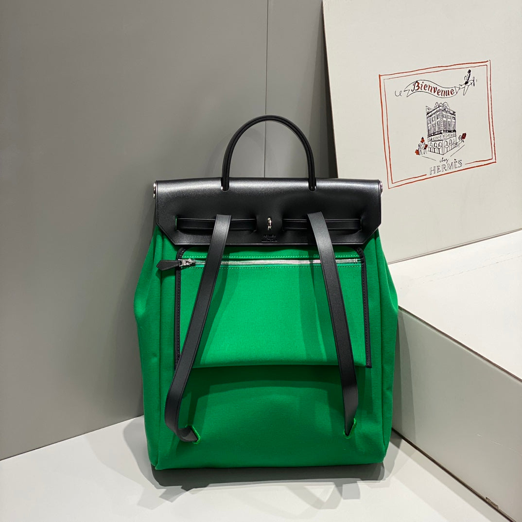 HERMES HERBAG A DOS ZIP RETOURNE BACKPACK 29 IN GREEN CANVAS AND BLACK CALFSKIN