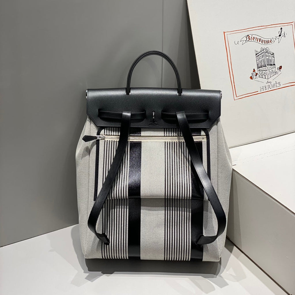 HERMES HERBAG A DOS ZIP RETOURNE BACKPACK 29 IN OFF-WHITE MIX BLACK CANVAS AND CALFSKIN
