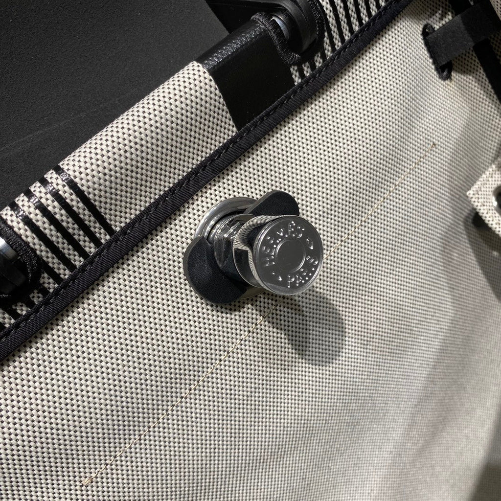 HERMES HERBAG A DOS ZIP RETOURNE BACKPACK 29 IN OFF-WHITE MIX BLACK CANVAS AND CALFSKIN