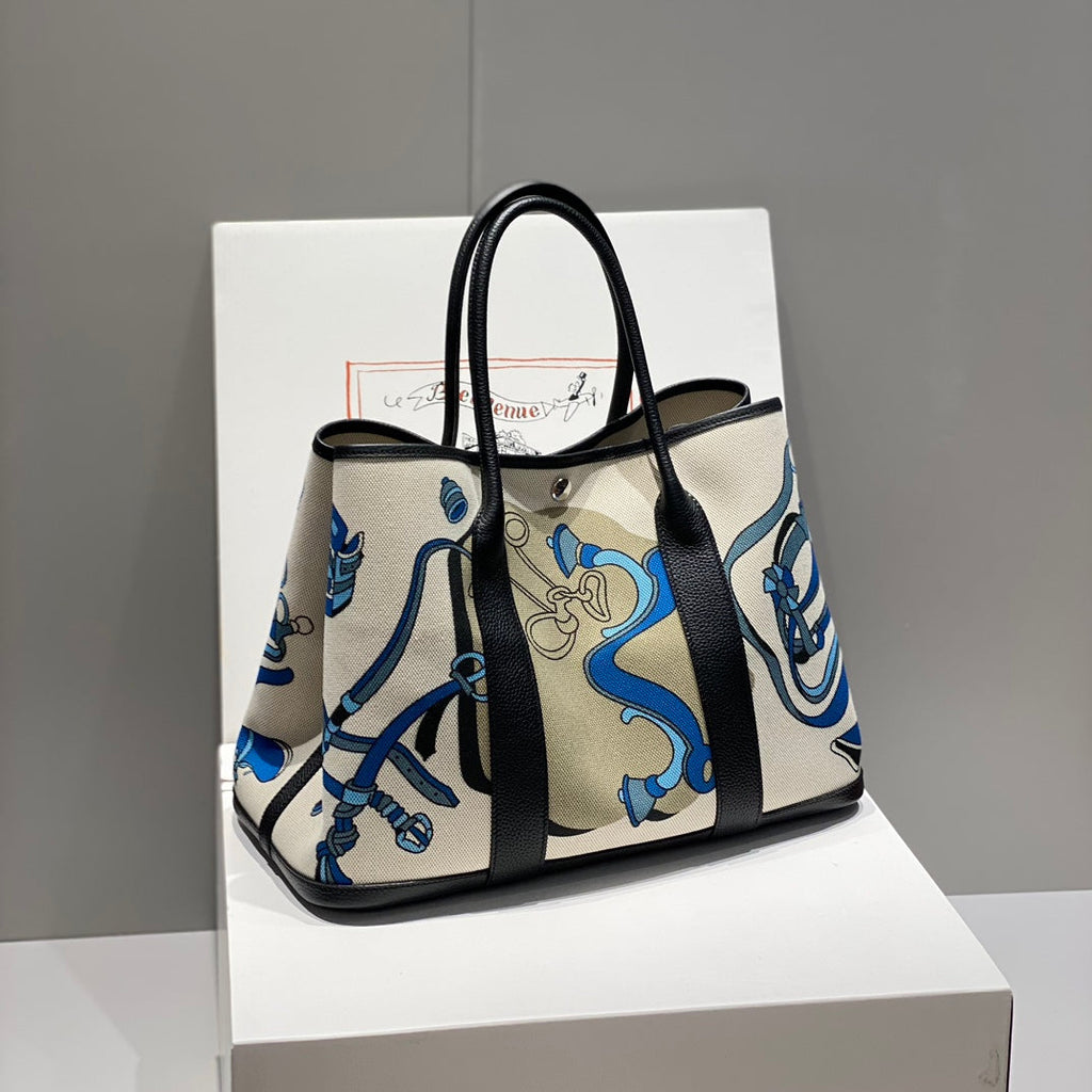 HERMES GARDEN PARTY 36 IN BLUE IVORY TOILE H CANVAS BLACK CALFSKIN EQUESTRIAN HARNESS PRINT