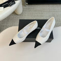 CHANEL MARY JANE IN WHITE TWEED AND BLACK SATIN