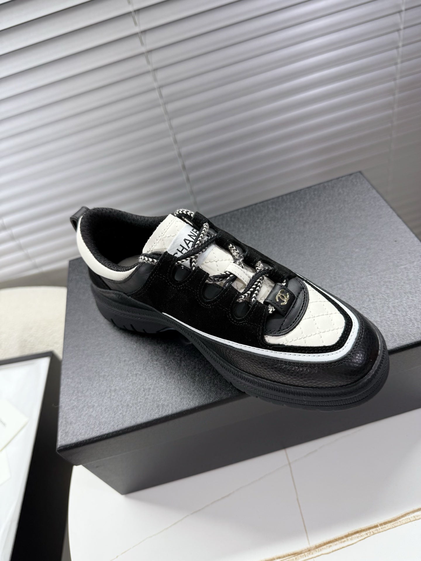 CHANEL 25S SNEAKERS 35MM IN BLACK AND WHITE CALFSKIN