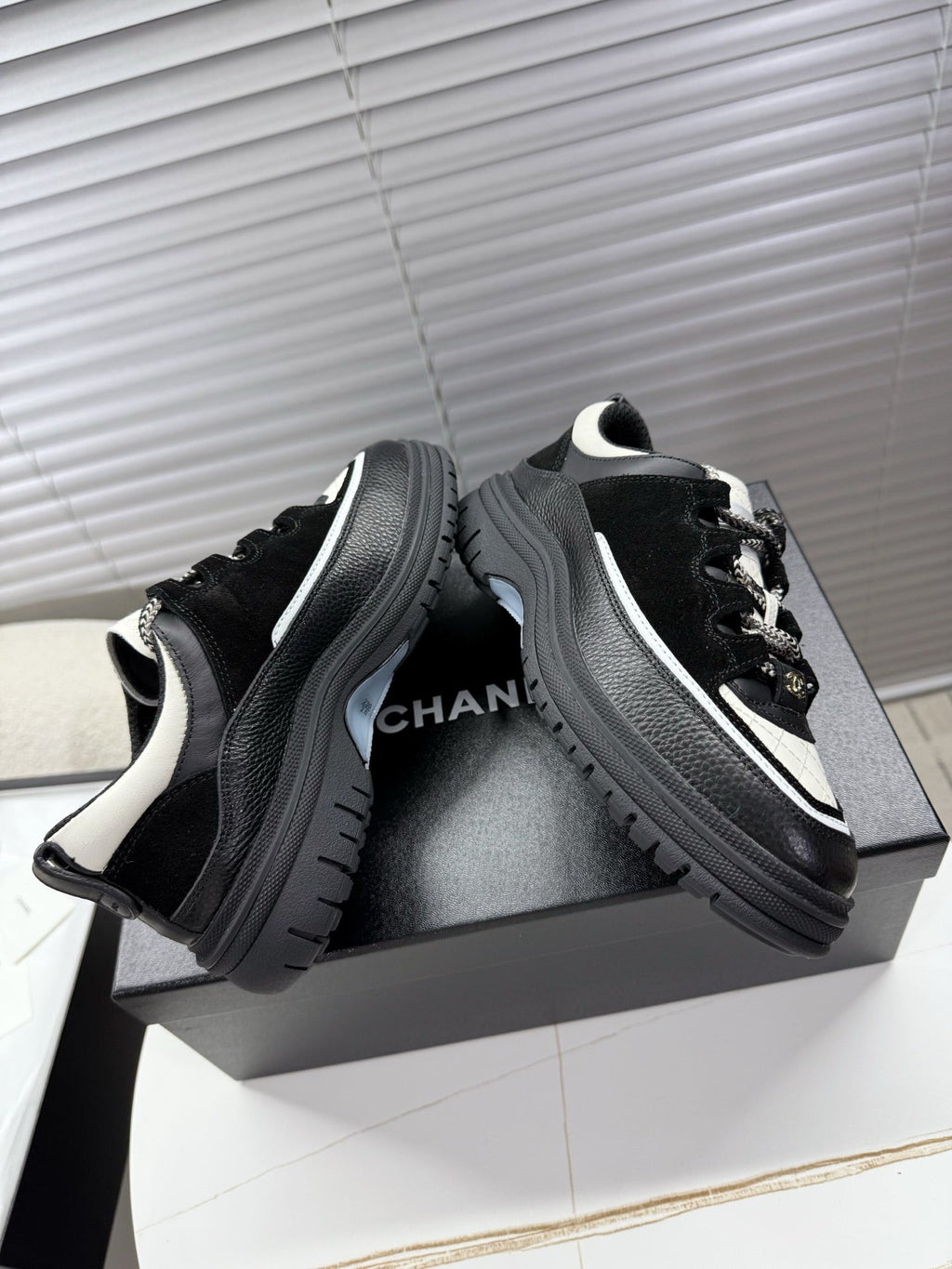 CHANEL 25S SNEAKERS 35MM IN BLACK AND WHITE CALFSKIN