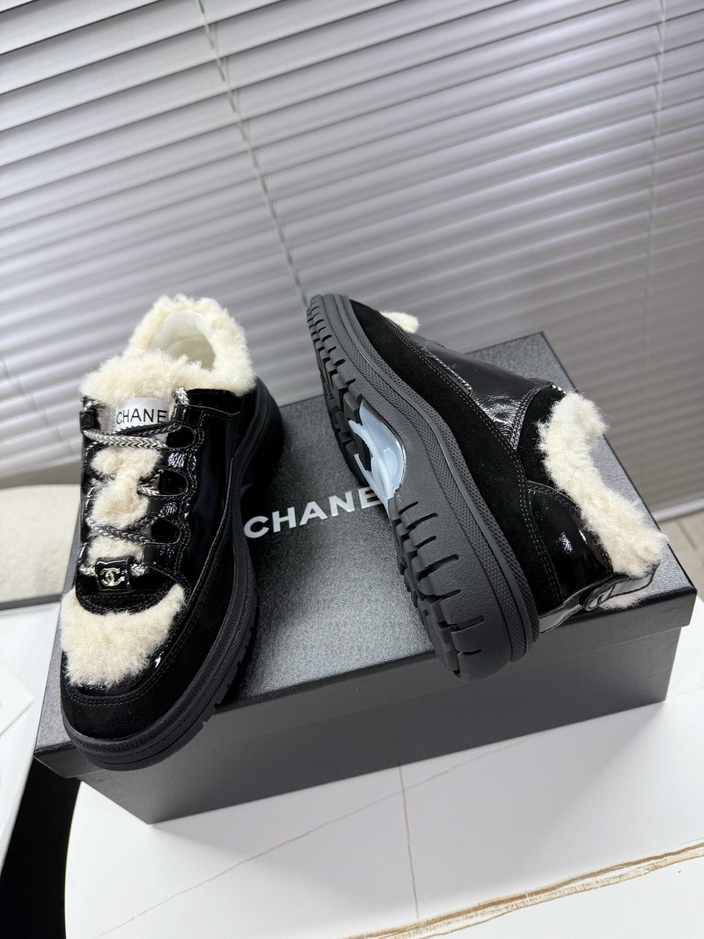 CHANEL 25S SNEAKERS WITH FUR AENTS 35MM IN BLACK CALFSKIN