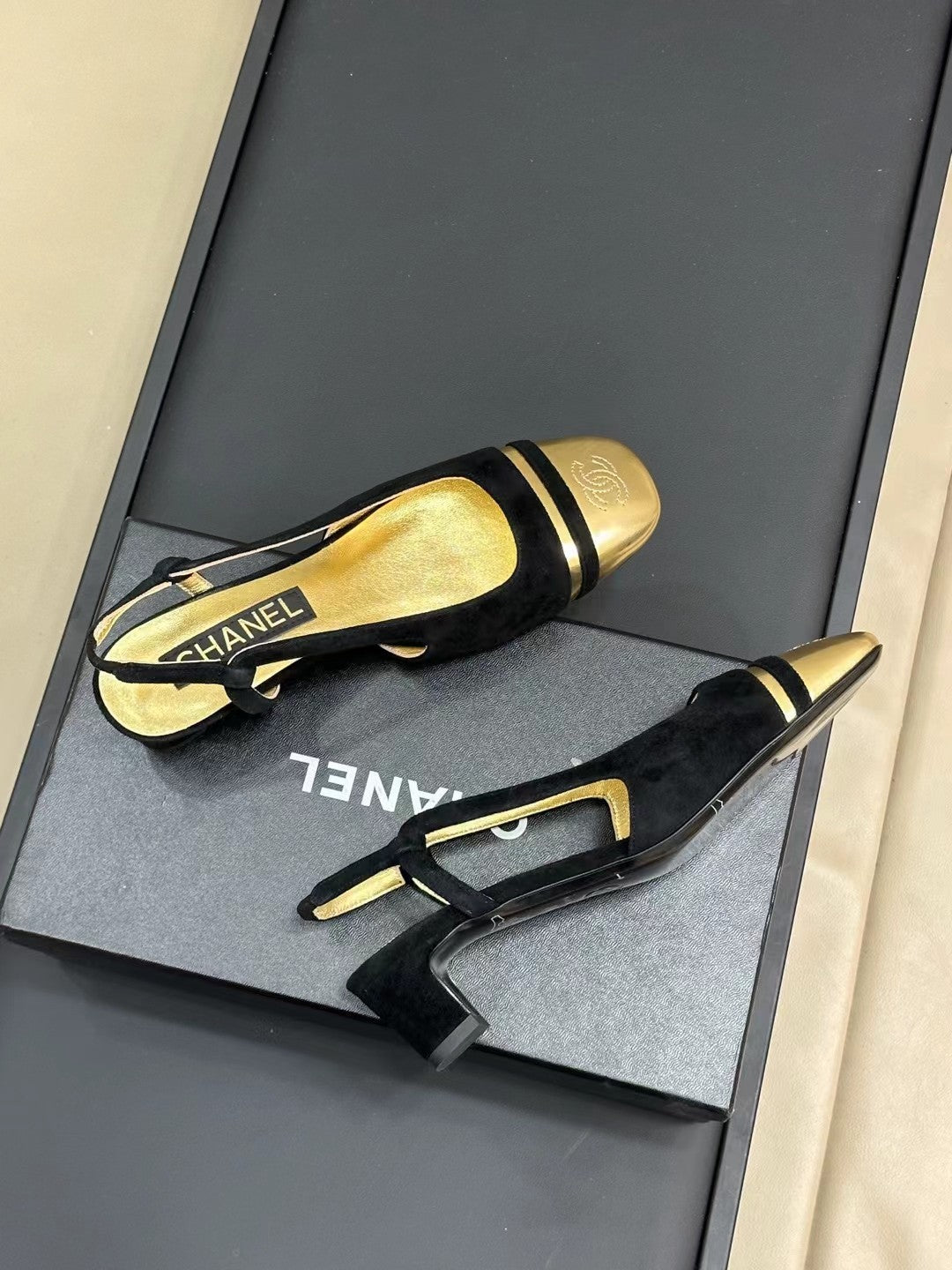 CHANEL SLINGBACKS IN BLACK SUEDE AND GOLDEN LAMBSKIN