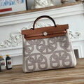 HERMES HERBAG ZIP 31 LAQUERED BAG IN OFF-WHITE MIX BROWN H PLUME CANVAS AND BROWN COWHIDE