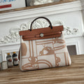 HERMES BOLSO HERBAG ZIP 31 RETOURNE BAG IN OFF-WHITE MIX BROWN H VIKING CANVAS AND COWHIDE