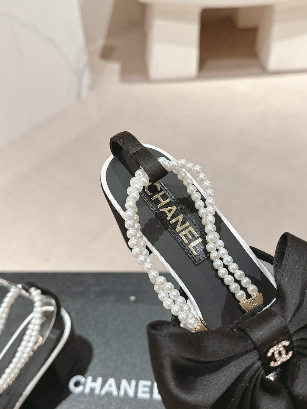 CHANEL HIGH SANDAL WITH PEARL CHAIN BLACK LAMBSKIN WITH WHITE RHINESTONES