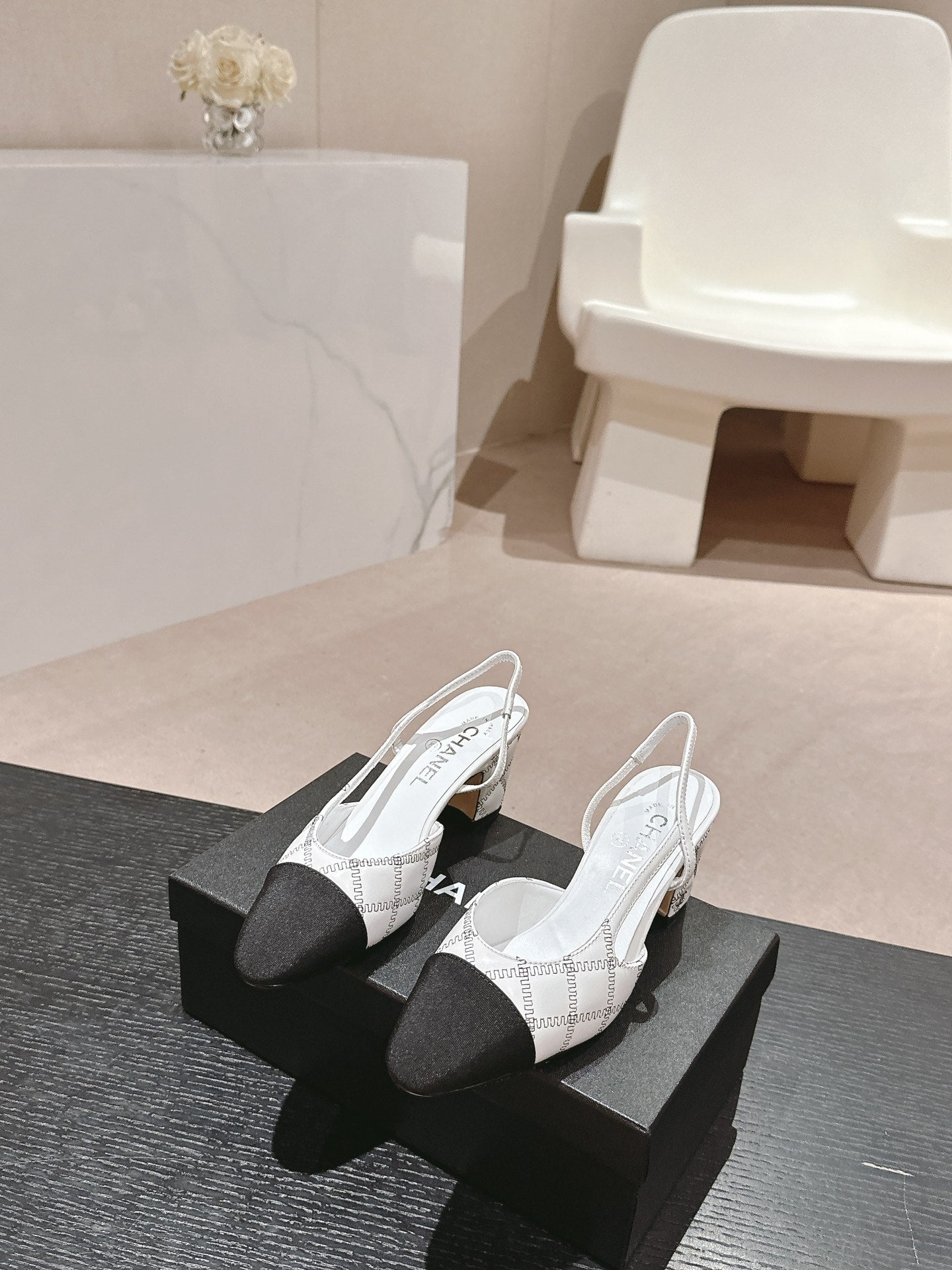 CHANEL HIGH SLINGBACKS IN WHITE LAMBSKIN AND BLACK SATIN