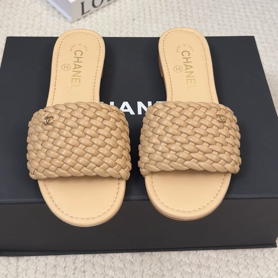 CHANEL FLAT SLIDES IN FLAX YELLOW LAMBSKIN