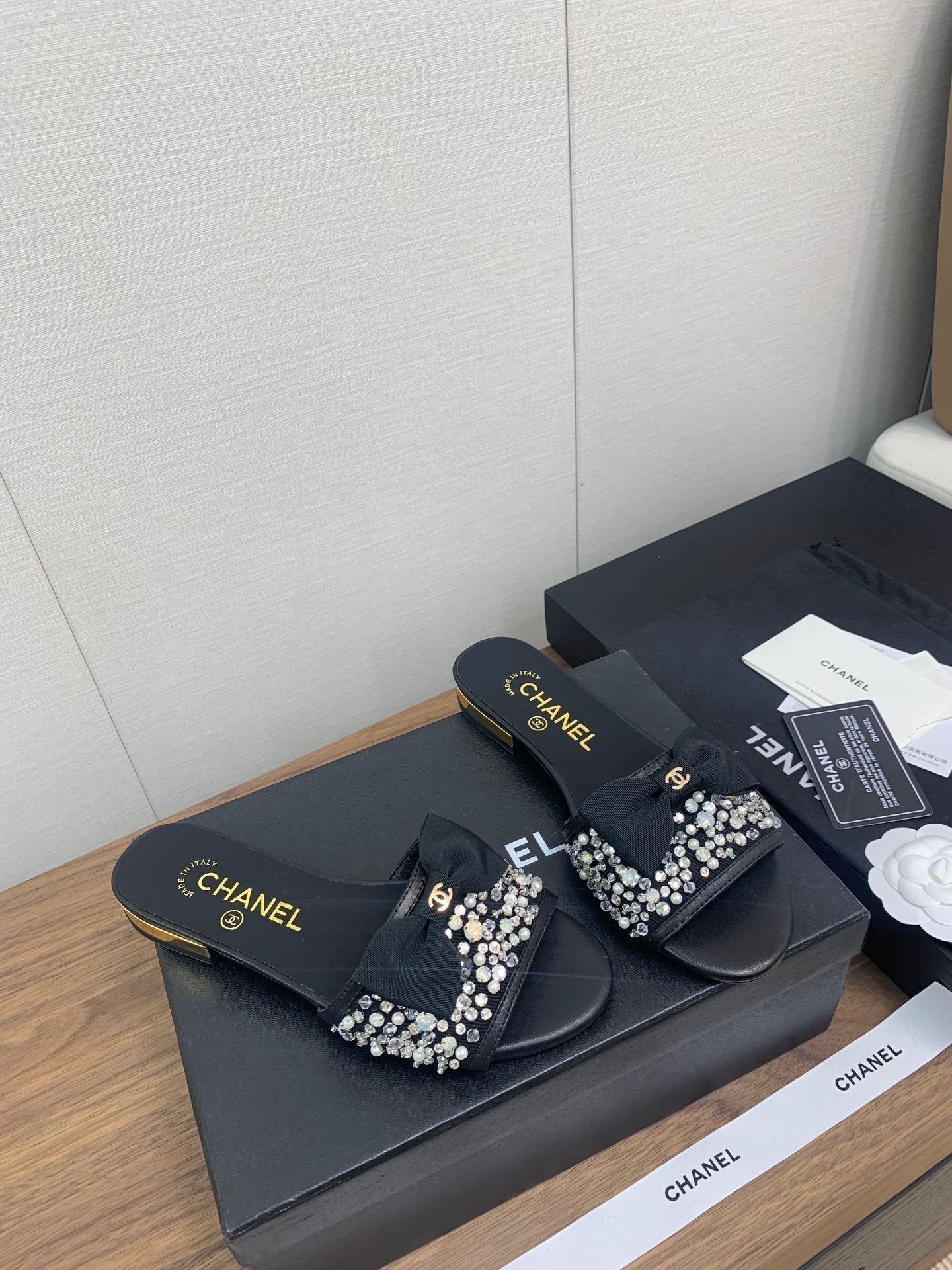 CHANEL BOW SLIPPERS IN BLACK LAMBSKIN WITH RHINESTONES