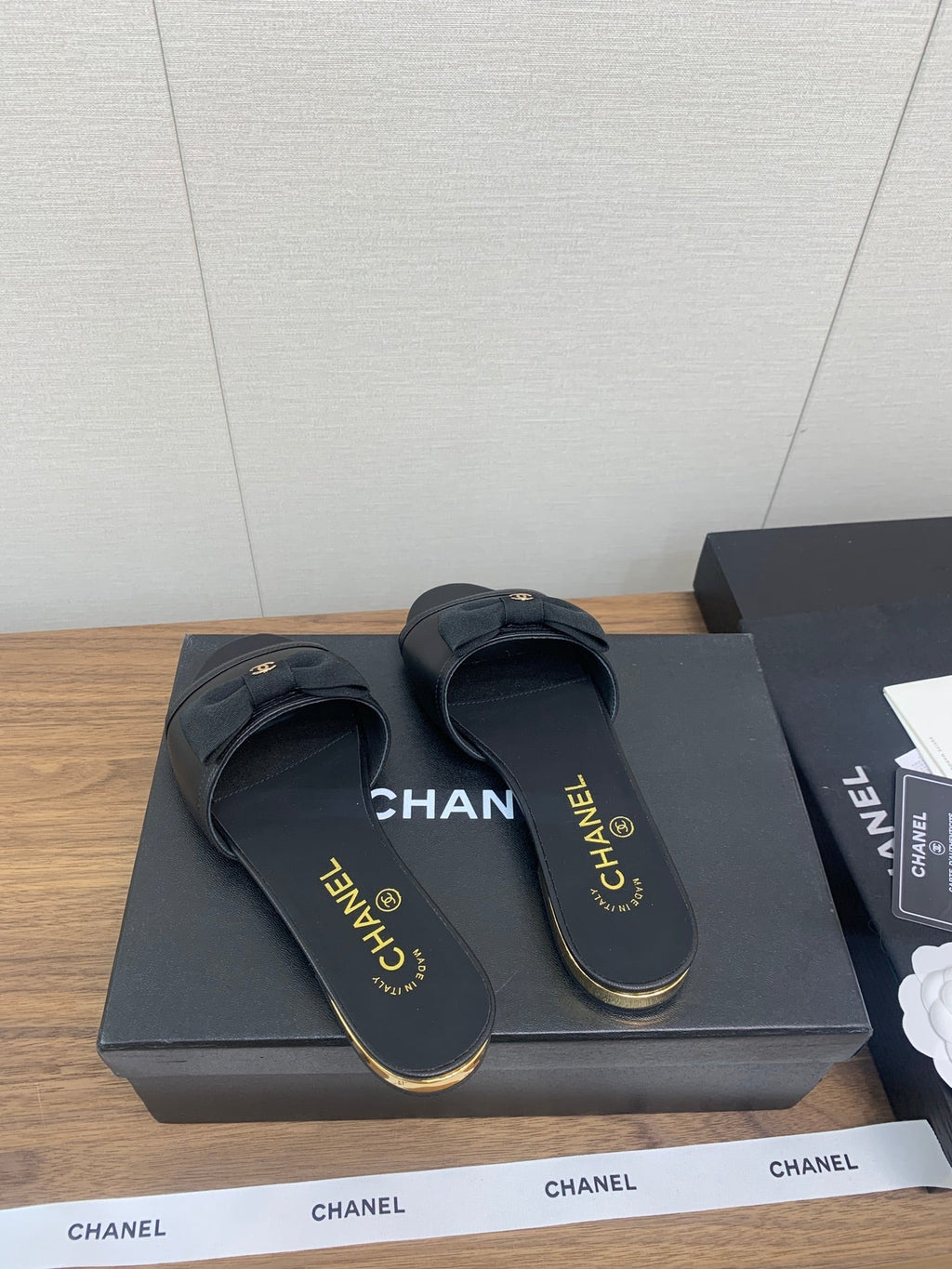 CHANEL BOW SLIPPERS IN BLACK LAMBSKIN