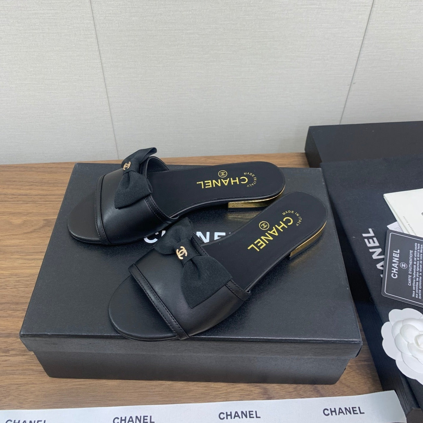 CHANEL BOW SLIPPERS IN BLACK LAMBSKIN