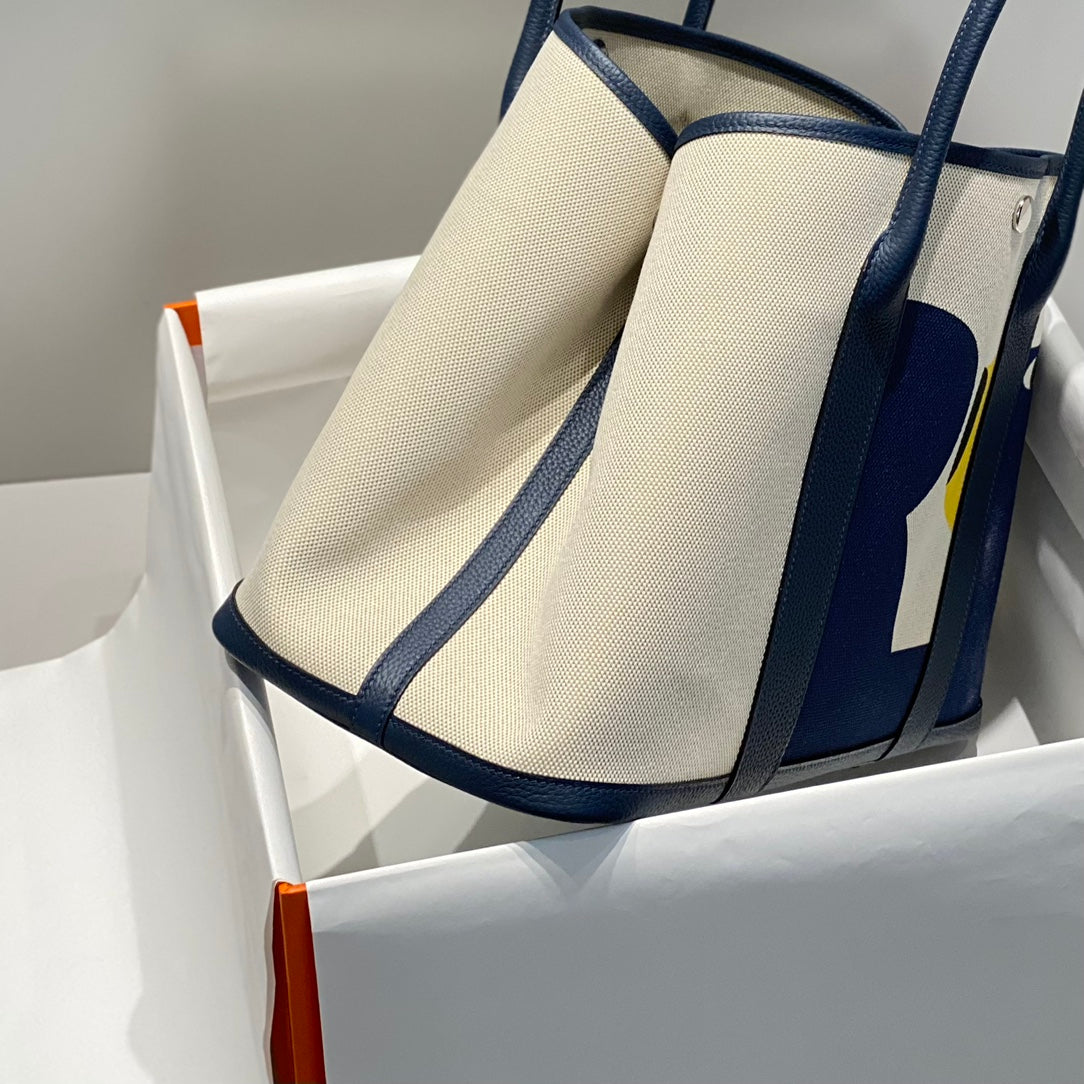 HERMES GARDEN PARTY 36 IN NAVY CREAM TOILE H CANVAS BLUE MARINE CALFSKIN ABSTRACT BEAR FACE PRINT