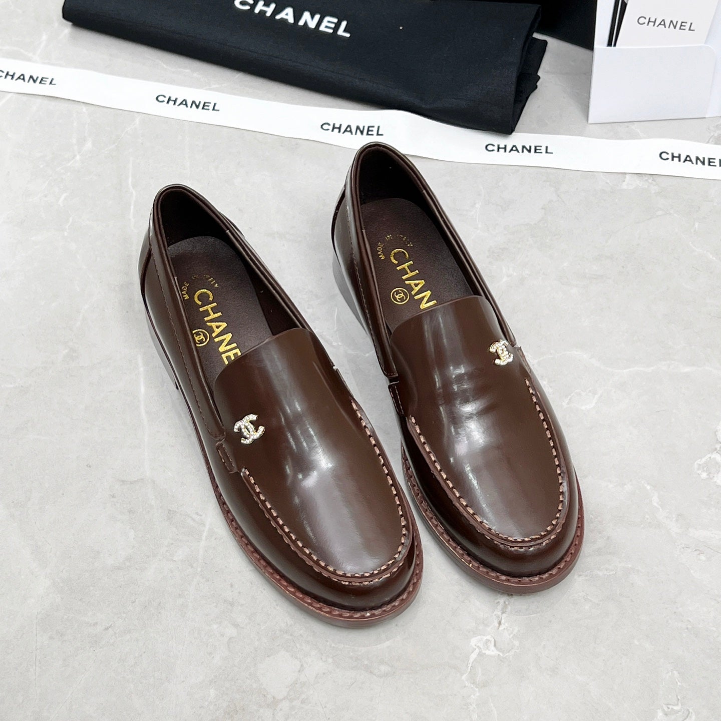 CHANEL MOASINS IN BROWN CALFSKIN