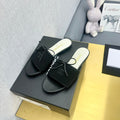 CHANEL BOW SLIPPERS IN BLACK LAMBSKIN