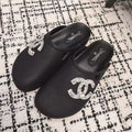 CHANEL FLAT MULES IN BLACK CALFSKIN