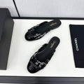 CHANEL BOW MULE IN BLACK MIX WHITE FUR AND CALFSKIN