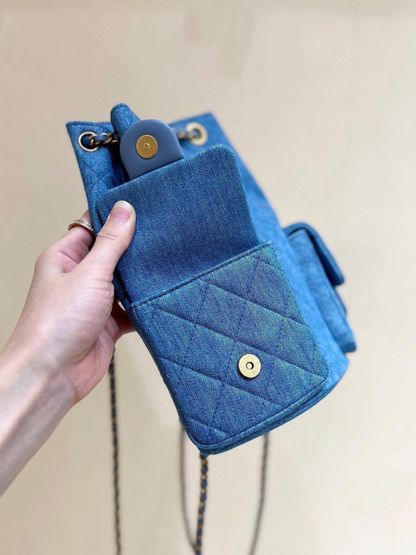 CHANEL DRAWSTRING BUCKET BACKPACK 24 IN MALIBU BLUE DENIM GOLD HARDWARE