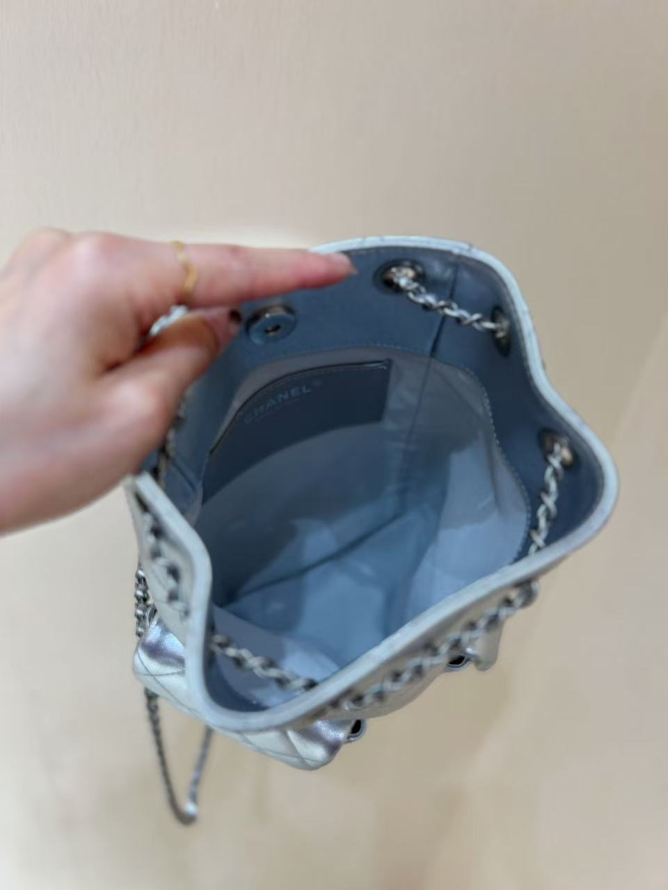 CHANEL DRAWSTRING BUCKET BACKPACK 24 IN SILVER-TONE LAMBSKIN SILVER HARDWARE